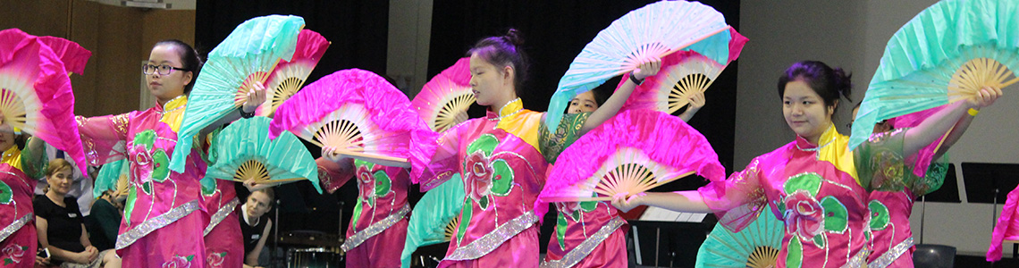 international students dancing in traditional Chinese costume